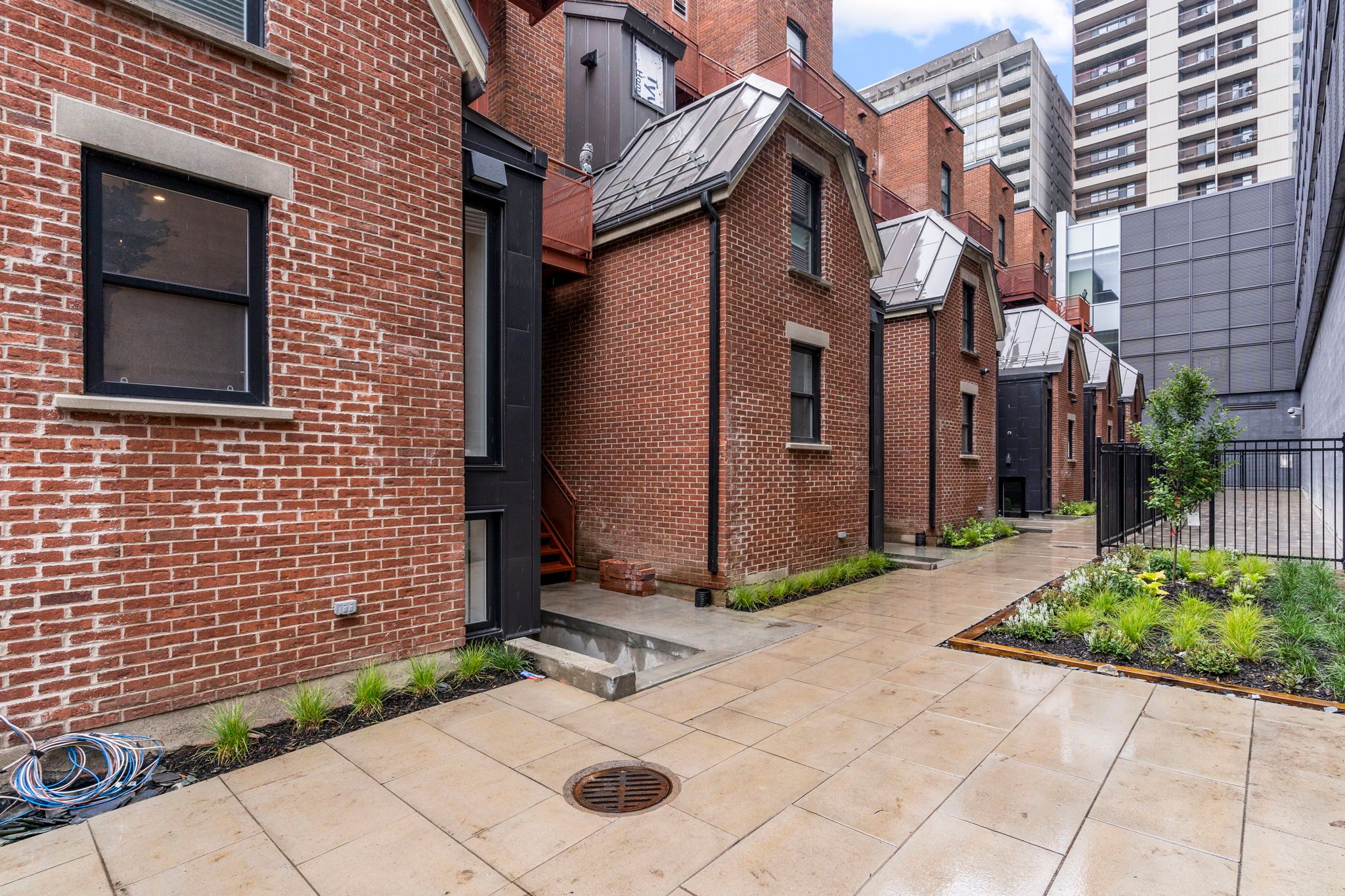 Nineteenth-Century Brick Sheds Become Tiny Apartments in Downtown Montreal